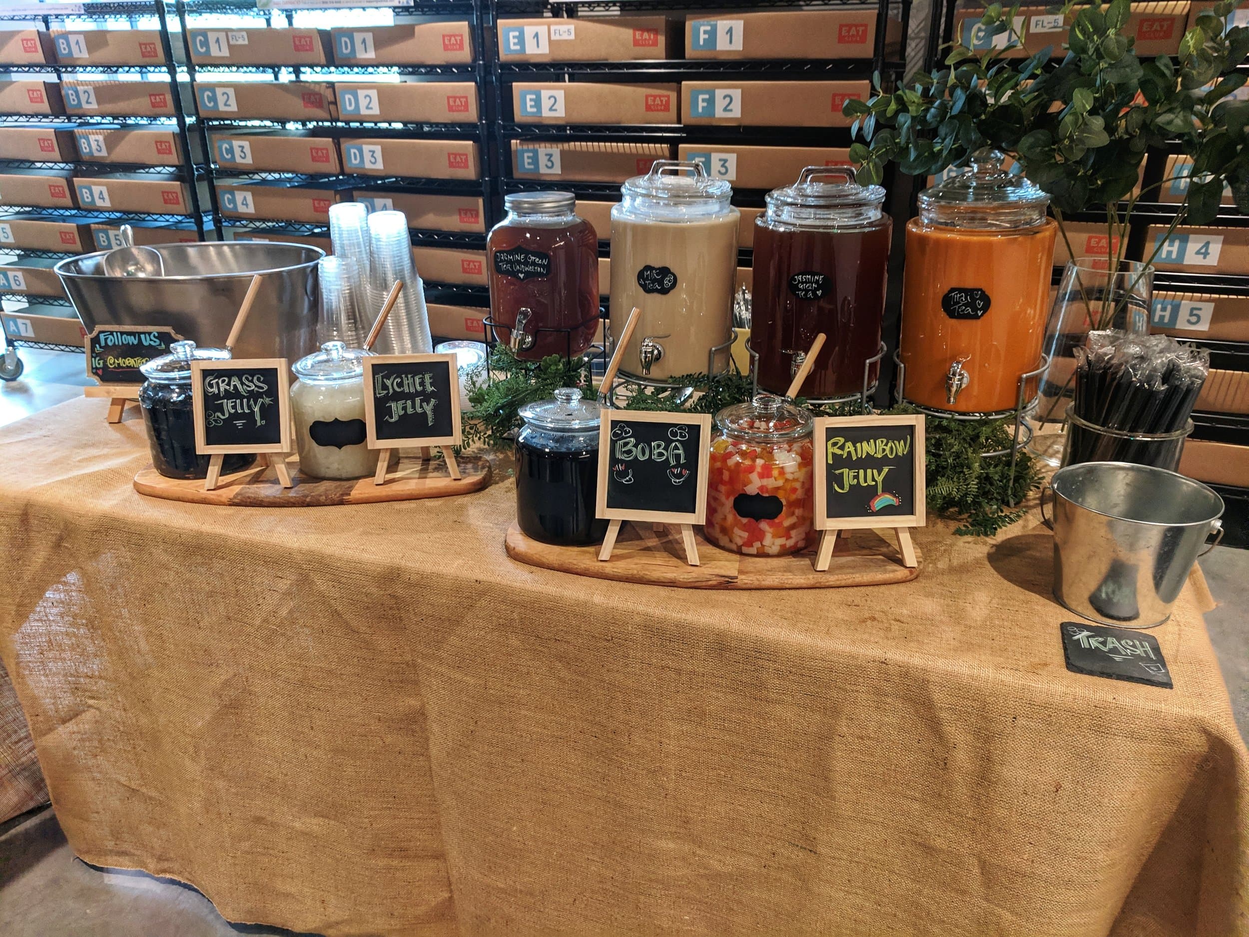 ColdBrewTeas full catering setup with glass dispensers and toppings